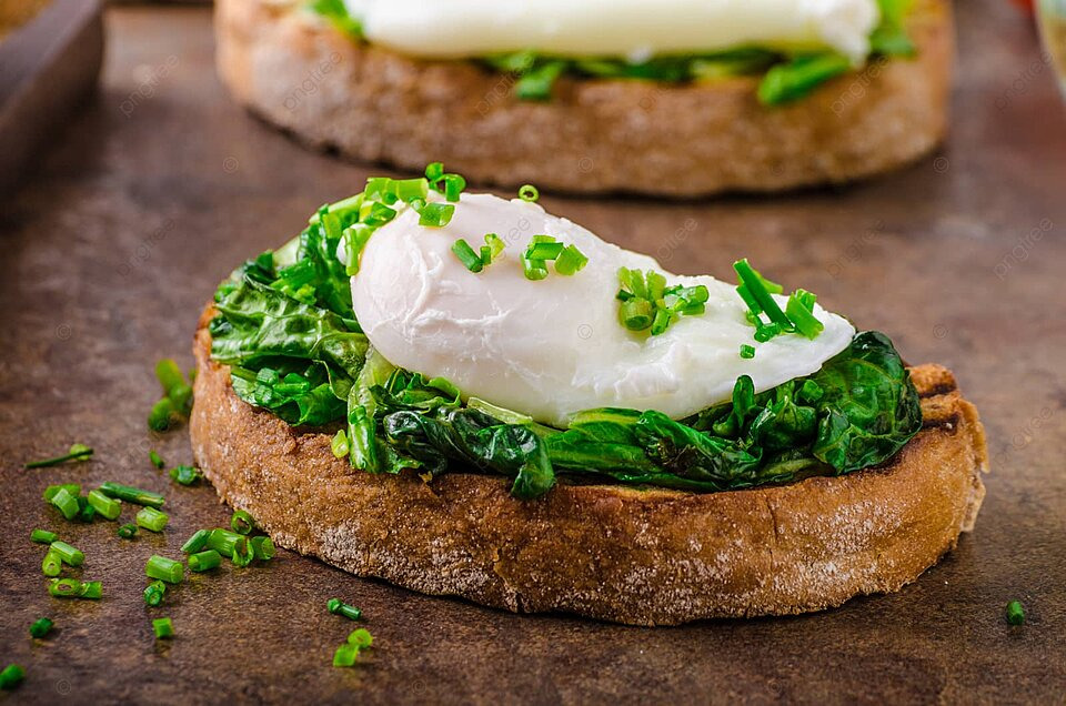 pngtree-bread-with-poached-eggg-and-spinach-background-lettuce-poached-photo-image_22972850.jpeg
